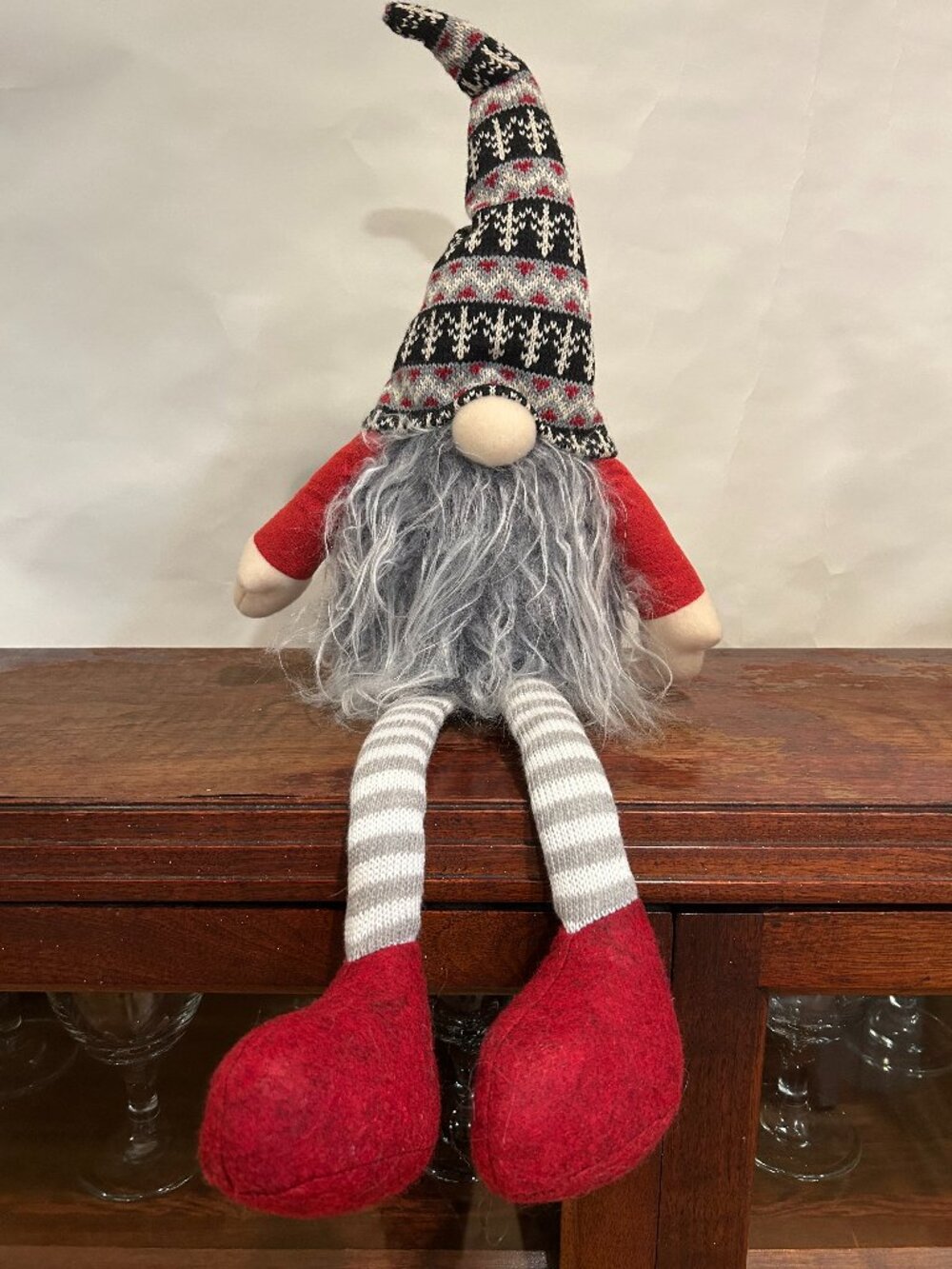 Christmas Holiday Gnome with knit cap, striped stockings and wispy gray beard